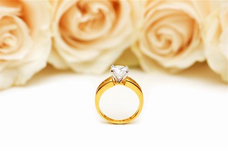 simsearch:400-05244104,k - Roses and wedding ring isolated on the white Stock Photo - Budget Royalty-Free & Subscription, Code: 400-04359680