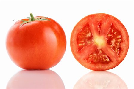 simsearch:400-04347888,k - Eine frische reife rote Fachwerk-Tomaten, isolated on White. Stockbilder - Microstock & Abonnement, Bildnummer: 400-04359866