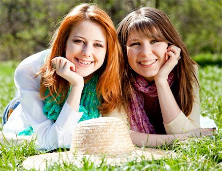 simsearch:400-05372366,k - Girlfriends at green grass in the park. Photographie de stock - Aubaine LD & Abonnement, Code: 400-04359891