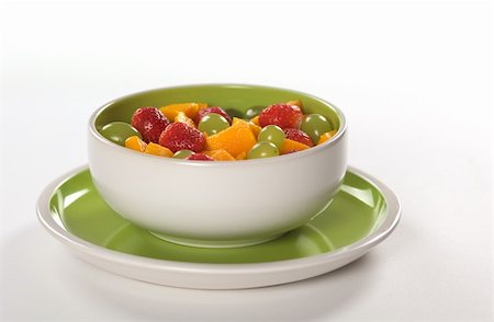 simsearch:400-04859746,k - Healthy fresh fruit salad out of mango, strawberry and white grapes in green-white bowl photographed on white (Selective Focus, Focus on the middle) Foto de stock - Super Valor sin royalties y Suscripción, Código: 400-04350275