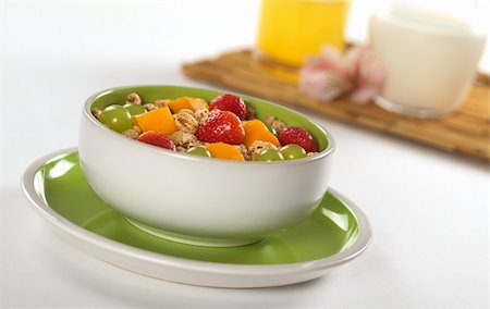puffed wheat - Fresh and healthy breakfast: Fruit salad out of mango, strawberry and white grape with puffed wheat cereal and orange juice and milk in the background (Selective Focus, Focus on the middle of the bowl) Stock Photo - Budget Royalty-Free & Subscription, Code: 400-04350276