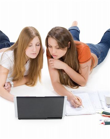 two young happy student girl work on laptop computer isolated on white Stock Photo - Budget Royalty-Free & Subscription, Code: 400-04350635