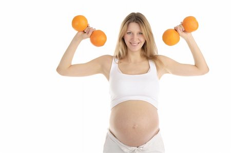 fruit facial - pregnant women involved in fitness dumbbells of oranges isolated on white Stock Photo - Budget Royalty-Free & Subscription, Code: 400-04350725