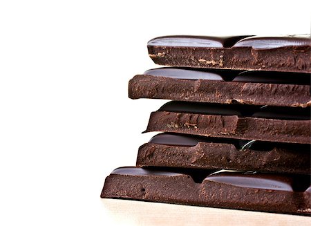 Chocolate bar on a table surface, back lit background. Fotografie stock - Microstock e Abbonamento, Codice: 400-04350929