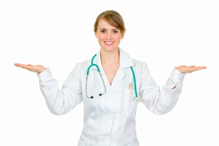 simsearch:400-07099823,k - Smiling medical doctor woman presenting something on empty hands isolated on white Stock Photo - Budget Royalty-Free & Subscription, Code: 400-04351234
