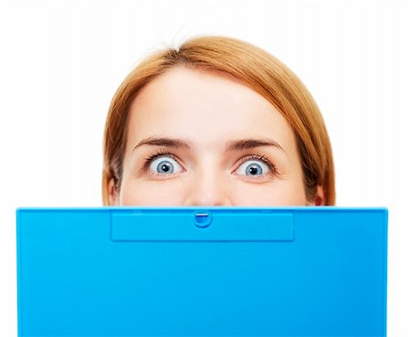 funny office mad - Surprised girl looking out of the tablet Stock Photo - Budget Royalty-Free & Subscription, Code: 400-04351248