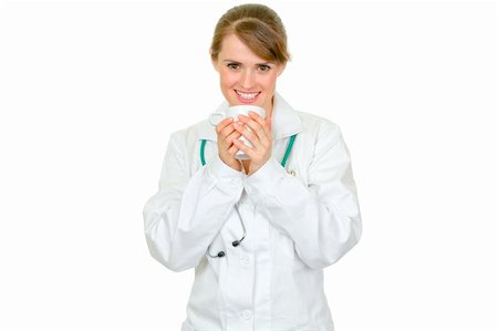 simsearch:400-04351236,k - Smiling medical doctor woman holding cup in hands  isolated on white Photographie de stock - Aubaine LD & Abonnement, Code: 400-04351325