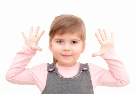 raysay (artist) - little girl rises hands up and shows ten fingers on white Foto de stock - Royalty-Free Super Valor e Assinatura, Número: 400-04351352