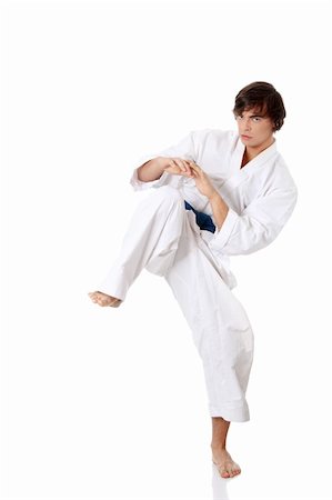 Karate. Man in a kimono , isolated on the white background Stock Photo - Budget Royalty-Free & Subscription, Code: 400-04351591