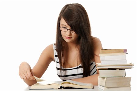 simsearch:400-05678148,k - Young student woman with lots of books studing for exams. isolated on white background Stockbilder - Microstock & Abonnement, Bildnummer: 400-04351619