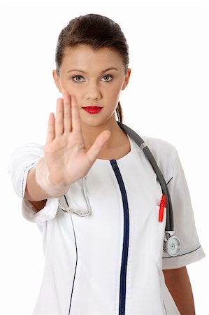 simsearch:400-06635276,k - Attractive female doctor showing stop gesture Photographie de stock - Aubaine LD & Abonnement, Code: 400-04351631