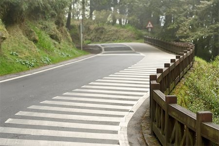 simsearch:400-05255892,k - Outdoor zebra stripes on road with mist in forest in Alishan National Scenic Area, Taiwan, Asia. Photographie de stock - Aubaine LD & Abonnement, Code: 400-04352045