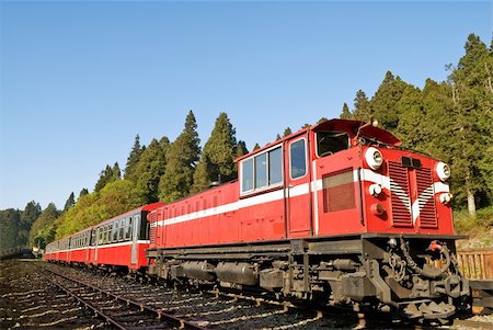 simsearch:400-05893951,k - Red train under blue sky on railway forest in Alishan National Scenic Area, Taiwan, Asia. Stock Photo - Budget Royalty-Free & Subscription, Code: 400-04352047