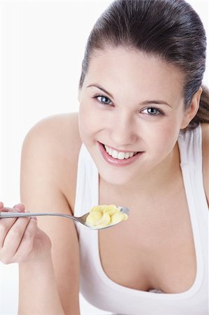 Attractive young girl with corn flakes Stock Photo - Budget Royalty-Free & Subscription, Code: 400-04352534