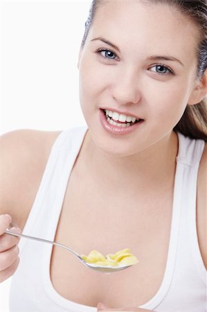 Attractive young girl with corn flakes Stock Photo - Budget Royalty-Free & Subscription, Code: 400-04352536