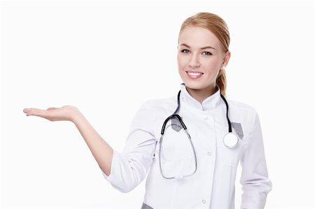 simsearch:400-04375768,k - A handsome young doctor shows on a white background Foto de stock - Royalty-Free Super Valor e Assinatura, Número: 400-04352573