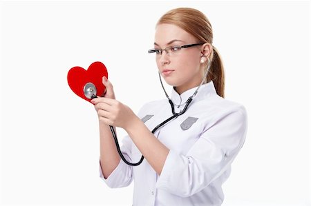 simsearch:400-04375768,k - Young doctor listens to the "heart" on a white background Foto de stock - Royalty-Free Super Valor e Assinatura, Número: 400-04352665