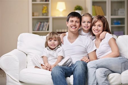 family lamp home - Smiling family home evening Stock Photo - Budget Royalty-Free & Subscription, Code: 400-04352737