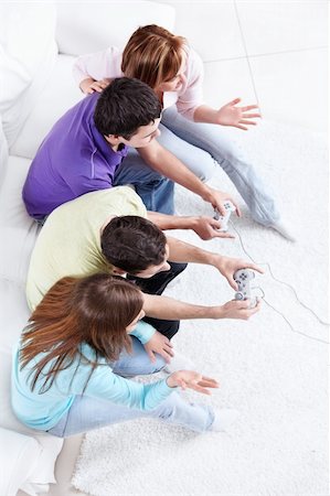 friendship videos on four friends - Young people playing video games Stock Photo - Budget Royalty-Free & Subscription, Code: 400-04352757