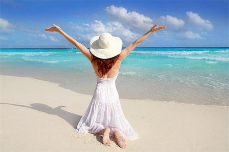 Caribbean beach woman rear on knees open arms happy vacation gesture Stock Photo - Budget Royalty-Free & Subscription, Code: 400-04352844