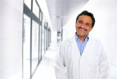 Indian latin doctor expertise smiling in hospital corridor Stock Photo - Budget Royalty-Free & Subscription, Code: 400-04352863