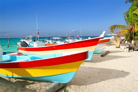 colorful tropical boats beached in the sand Isla Mujeres Mexico Fotografie stock - Microstock e Abbonamento, Codice: 400-04352870