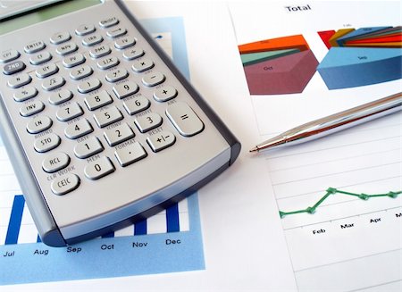 Calculator  and pen on the investment charts Stock Photo - Budget Royalty-Free & Subscription, Code: 400-04353157