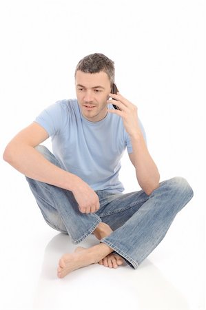 simsearch:400-05751258,k - casual young man speaking on the mobile phone. isolated Stock Photo - Budget Royalty-Free & Subscription, Code: 400-04353226
