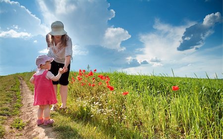 family outdoors and bright sun - Mom with daughter amongst poppy-field Stock Photo - Budget Royalty-Free & Subscription, Code: 400-04353804