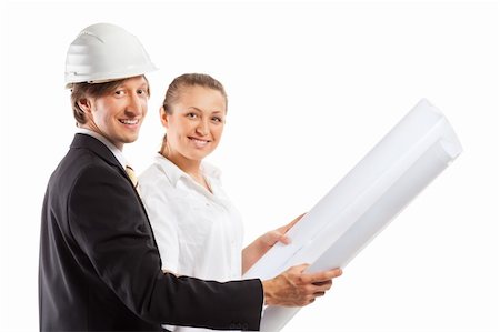 An architect wearing a hard hat and co-worker reviewing blueprints Stockbilder - Microstock & Abonnement, Bildnummer: 400-04353978