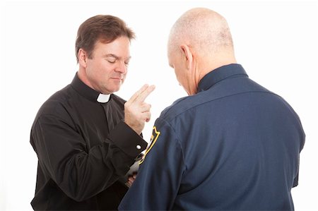 Priest blesses a police officer.  Isolated on white. Foto de stock - Super Valor sin royalties y Suscripción, Código: 400-04364309