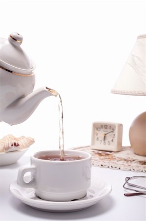 teapot and cup filled with black tea Stock Photo - Budget Royalty-Free & Subscription, Code: 400-04364639