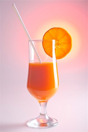 simsearch:400-05895285,k - Glass with juice and lemon on the white background Fotografie stock - Microstock e Abbonamento, Codice: 400-04364640