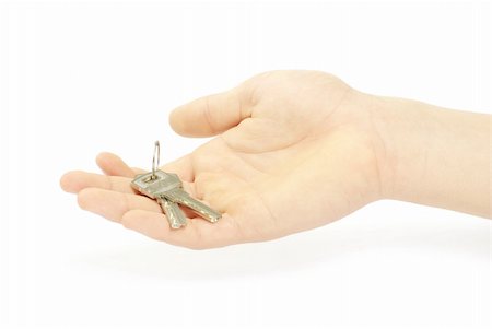 simsearch:400-07061230,k - hand holds a key isolated on white Photographie de stock - Aubaine LD & Abonnement, Code: 400-04366070