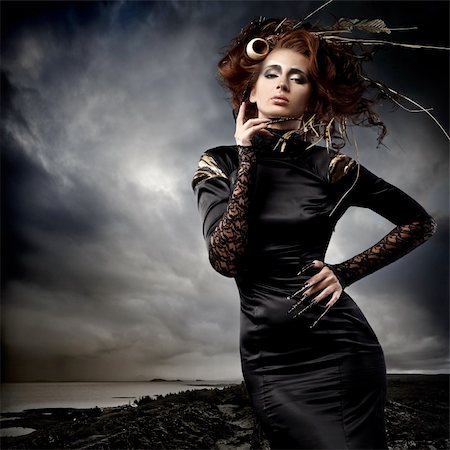 simsearch:400-04363105,k - High fashion model in black dress, with long nails and creative hairstyling and makeup in stormy weather Foto de stock - Super Valor sin royalties y Suscripción, Código: 400-04366155