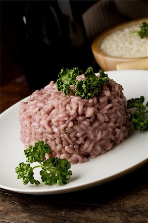 photo of delicious risotto with red wine on wooden table Stockbilder - Microstock & Abonnement, Bildnummer: 400-04366423
