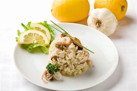 photo of delicious risotto with seafood on white isolated background Stockbilder - Microstock & Abonnement, Bildnummer: 400-04366444