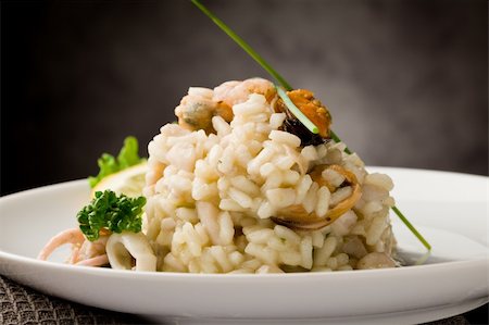 seafood risotto - photo of delicious risotto with seafood and parsley on it Stock Photo - Budget Royalty-Free & Subscription, Code: 400-04366449