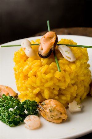 seafood risotto - photo of delicious risotto with saffron and seafood on wooden table Stock Photo - Budget Royalty-Free & Subscription, Code: 400-04366440