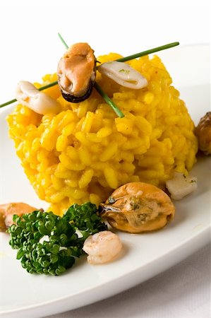 seafood risotto - photo of delicious risotto with saffron and seafood on white isolated background Stock Photo - Budget Royalty-Free & Subscription, Code: 400-04366443