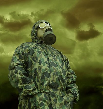 the man in anti-gas mask in vapours of gas Stock Photo - Budget Royalty-Free & Subscription, Code: 400-04366481