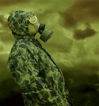 the man in anti-gas mask in vapours of gas Stock Photo - Budget Royalty-Free & Subscription, Code: 400-04366483