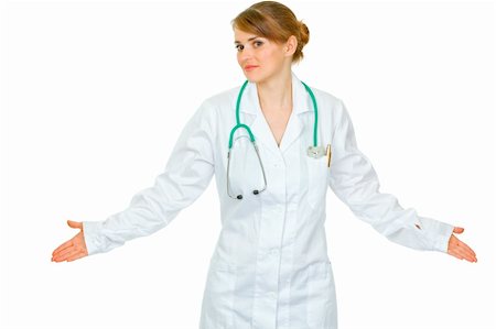 simsearch:400-04351236,k - Confused young medical doctor woman spreading hands apart isolated on white Photographie de stock - Aubaine LD & Abonnement, Code: 400-04367284