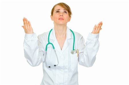 simsearch:400-04351236,k - Frustrated medical doctor woman looking up and  raising her hands isolated on white Stock Photo - Budget Royalty-Free & Subscription, Code: 400-04367286