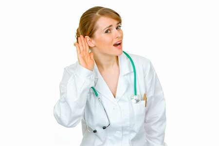 simsearch:400-04351236,k - Speak loud! Stressful medical doctor woman holding hand at ear and listening isolated on white Photographie de stock - Aubaine LD & Abonnement, Code: 400-04367288