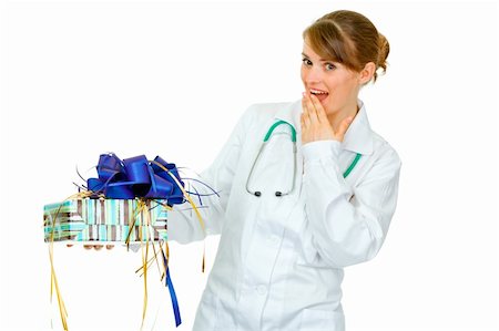 simsearch:400-04351236,k - Surprised medical doctor woman holding present in hand isolated on white Photographie de stock - Aubaine LD & Abonnement, Code: 400-04367298