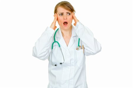 simsearch:400-04351236,k - Shocked medical doctor woman with hands at head looking at copy space isolated on white Photographie de stock - Aubaine LD & Abonnement, Code: 400-04367290