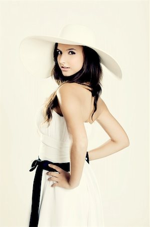 simsearch:400-04307166,k - Beautiful and fashion young woman posing and wearing a wonderful white dress with a white hat Stock Photo - Budget Royalty-Free & Subscription, Code: 400-04367373