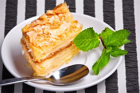 Napoleon cake with fresh mint on white plate Stock Photo - Budget Royalty-Free & Subscription, Code: 400-04368168