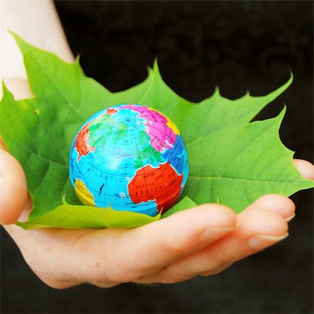 simsearch:400-05365467,k - save the world concept with hand leaf and globe Stock Photo - Budget Royalty-Free & Subscription, Code: 400-04368602